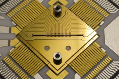 A segmented ion trap used to utilize quantum bits stored in ions for quantum operations. The trap is made of gold-coated ceramic, and the segments at its center are only 0.2 millimeters in size. photo/©: QUANTUM, JGU